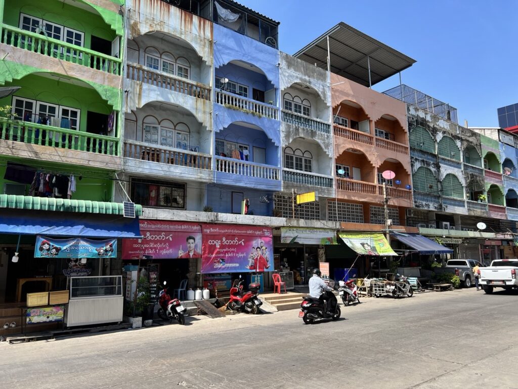 Burmese-language ads are a common sight in a neighbourhood of Samut Sakhon