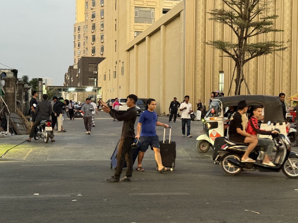 A Cambodian security guard directs traffic in front of Huangguan Chang Long Resort Hotel in Cambodia's Sihanoukville city on January 14, 2026. (Mech Dara/Mekong Independent)