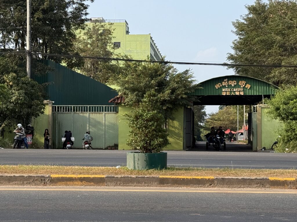 A motorized tractor or "koh yun" drives out the gates of the Hulk Casino compound in Cambodia's Sihanoukville city on January 15, 2026. (Mech Dara/Mekong Independent)