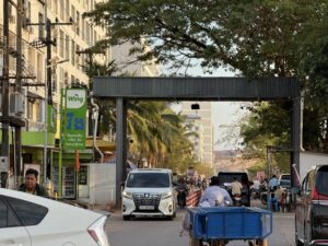 Vans, motorbikes and trailers drive in and out of a gate to the Koh Kong Resort during an opening-up of reported scam businesses in Cambodia's Koh Kong province on January 25, 2026. (Mech Dara/Mekong Independent/Creative Commons)