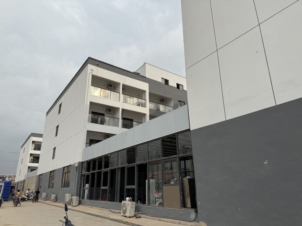 Broken glass windows line an under-construction complex called Prek Khsach on February 12, 2026, after foreign and Cambodian construction workers protested unpaid wages in Cambodia's Koh Kong province. (Mech Dara/Mekong Independent)
