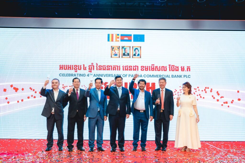 Li Xiong, left, raises a toast with other Panda Commercial Bank directors and government officials, in a photo posted online on March 1, 2024.