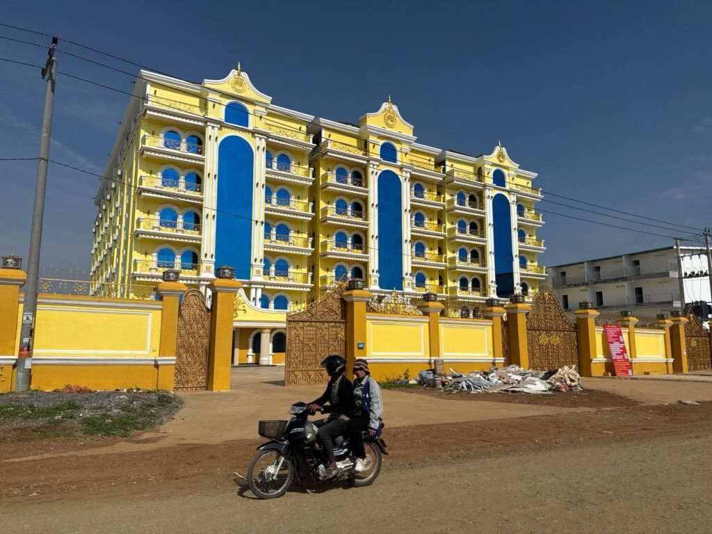 Three yellow buildings that allegedly hosted suspicious online business in Pailin's Stung Kach commune are being advertised for rent, on May 7, 2026. (Mech Dara/Mekong Independent/Creative Commons)