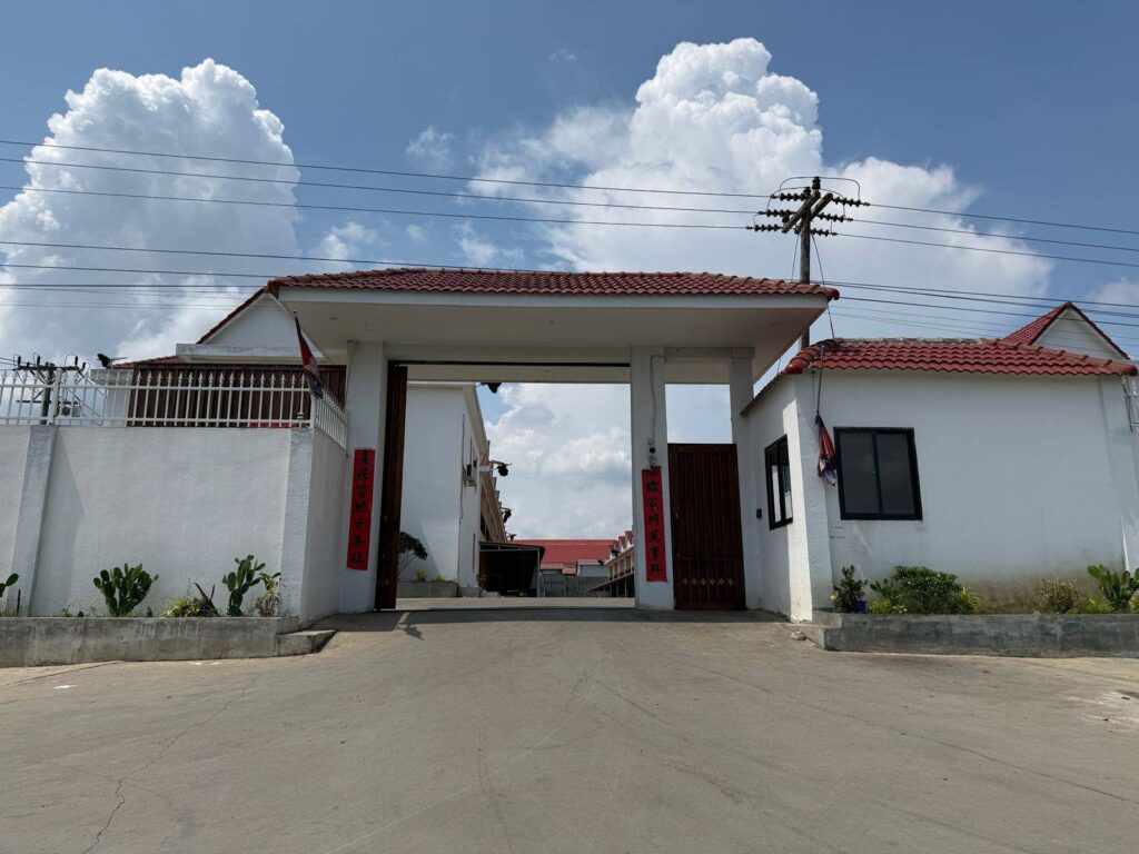 A second entrance to the Cangxinlong Food (Cambodia) complex that leads to groups of shophouses and villas in Pailin province's Stung Kach commune on May 7, 2026. (Mech Dara/Mekong Independent/Creative Commons)