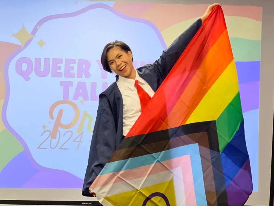A member of the Vientiane-based organization Queers & Cheers holds a Pride flag during a queer youth meetup of Lao activists, influencers and advocates for the LGBTQ+ community on June 15, 2024. (Supplied)
