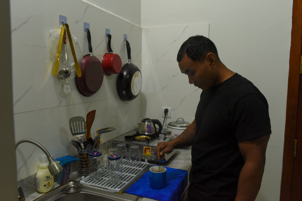 Pheap Rom makes coffee in his apartment in Phnom Penh on July 27, 2026. (Len Leng/Mekong Independent/Creative Commons)