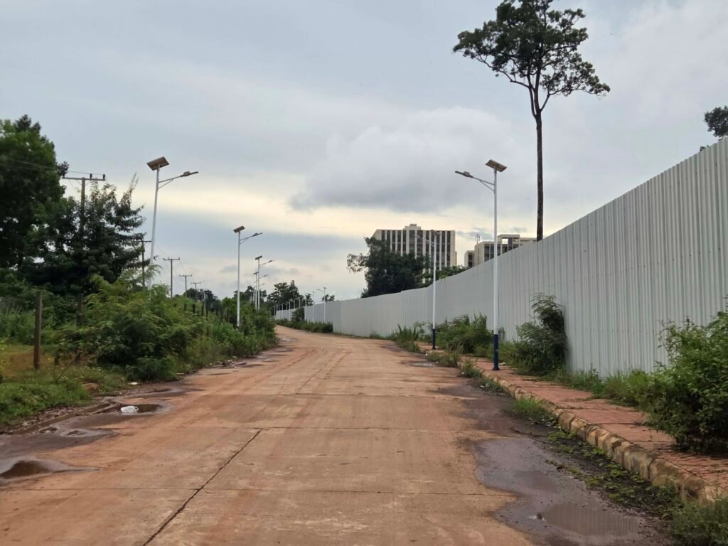 The road to a gated building complex in Vientiane city at the "Kilometer 16" area of the national road, which was alleged to house scam operations, on July 29, 2026. (Apichat Sopapong/Mekong Independent)