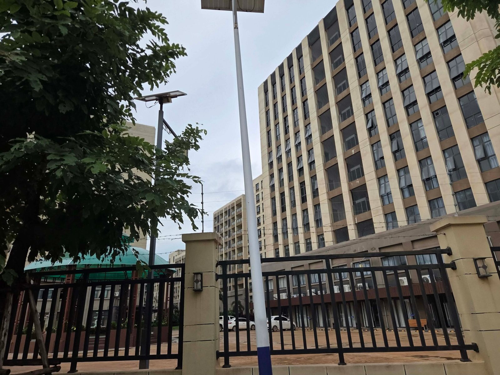 A gated complex with multiple 10-story buildings in Vientiane city at the "Kilometer 16" area of the national road, which was alleged to house scam operations, on July 29, 2026. (Apichat Sopapong/Mekong Independent)